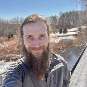 Portrait of Abe Millett on a roof